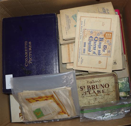 A collection of cigarette cards, loose and in albums including Players, Wills, Ogdens etc together with stamps, coins and tea cards.